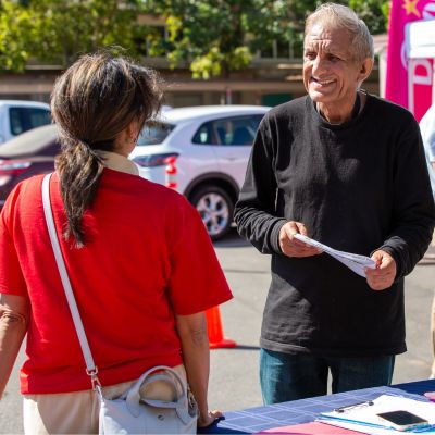 A man and woman talking at DaVita Community Health Experience